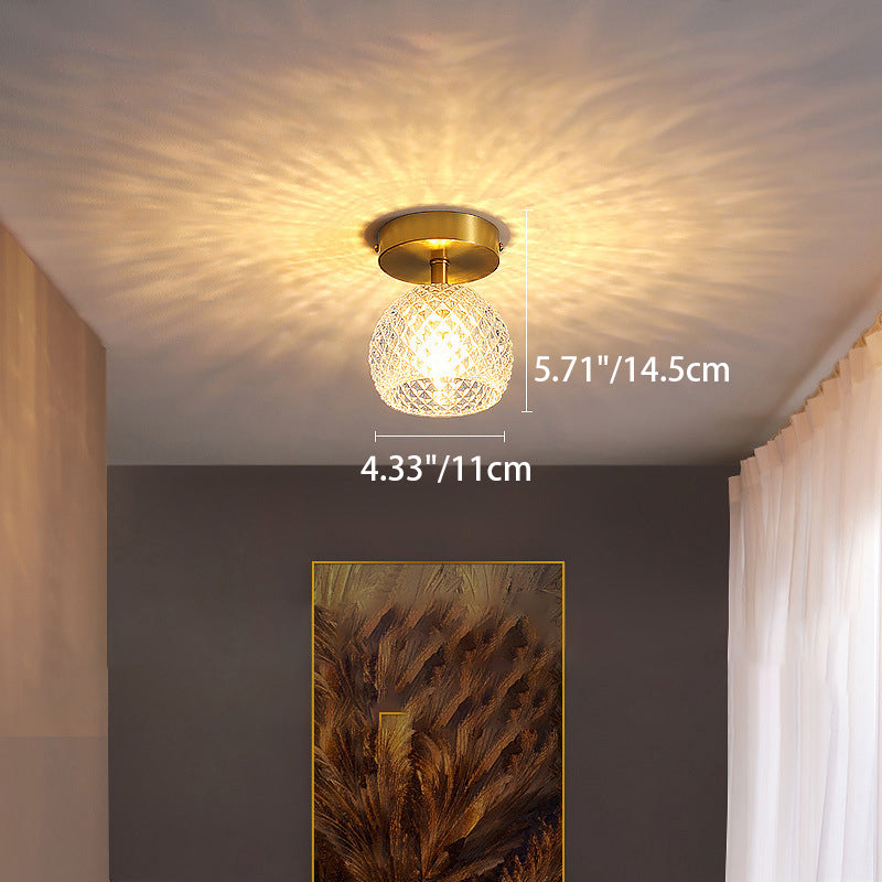 Maatdiagram voor de compacte halfverzonken plafondlamp van koperkleurig glas.