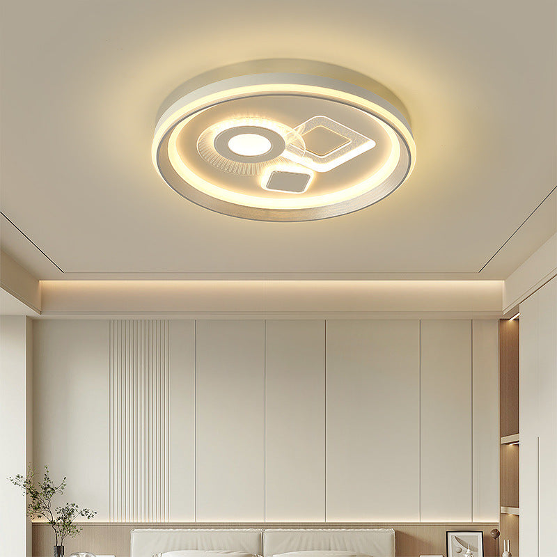 Scena di una camera da letto che mostra uno stile con una plafoniera a LED geometrica.