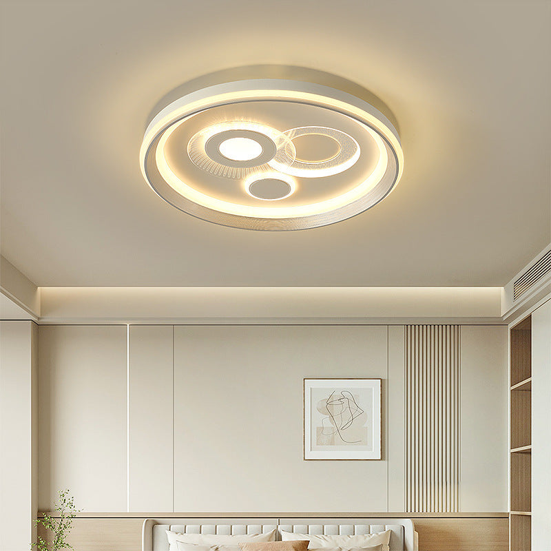 Scena di installazione in camera da letto che mostra la plafoniera geometrica rotonda in stile B.