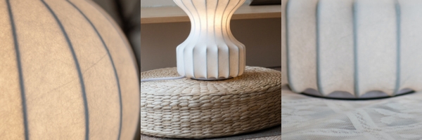 Detailopnamen van de coconvormige diffuser en de verlichte lampbehuizing.