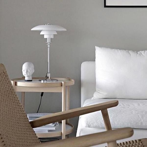 Opal glass table lamp shown in an interior setting