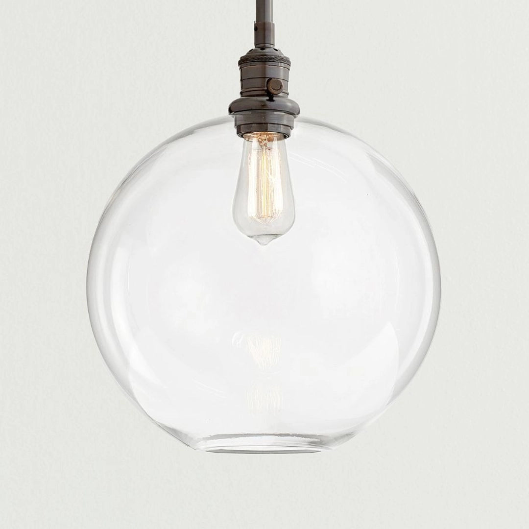 Claire Moderne Kugel-Pendelleuchte aus klarem Glas bronze.webp__PID:0a1a6c36-cba4-482c-ac91-ef782125852b