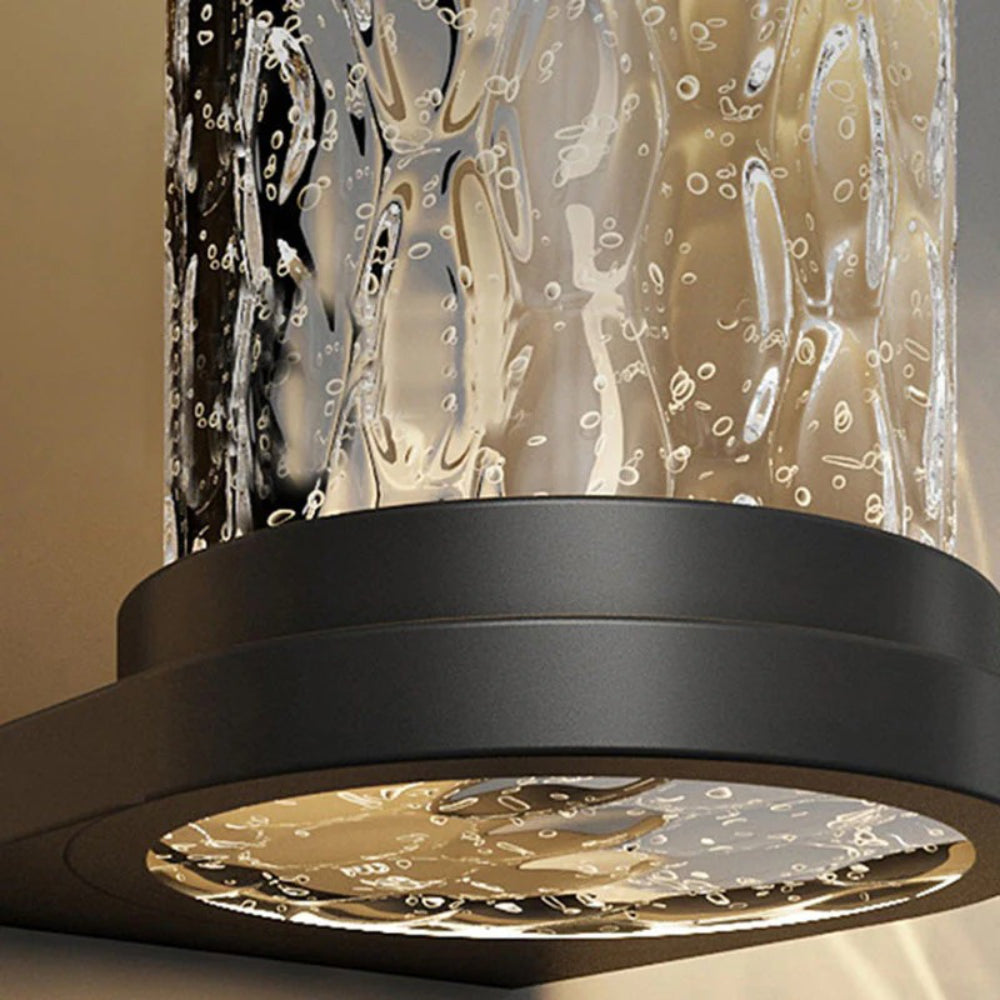 Applique murale cylindrique d'extérieur en verre nervuré Drew01.webp__PID:5e77f1d6-8a38-467f-82db-0aa16806b9cb