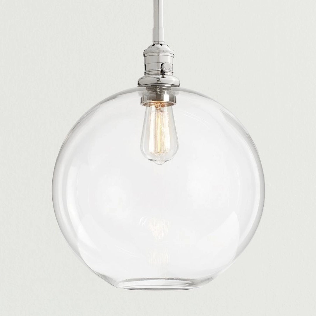 Claire Moderne Kugel-Pendelleuchte aus klarem Glas nickel.webp__PID:1a6c36cb-a438-4c6c-91ef-782125852b58